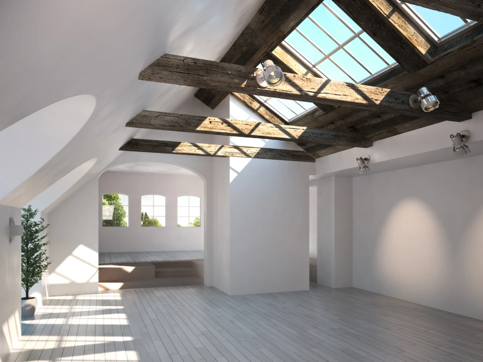 An empty room with a skylight and wooden beams, providing ample natural light and a rustic touch. An empty room with a skylight and wooden beams, providing ample natural light and a rustic touch.